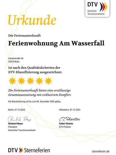 A certificate for the vacation apartment "At the Waterfall". The accommodation received the DTV classification with five stars for outstanding comfort.