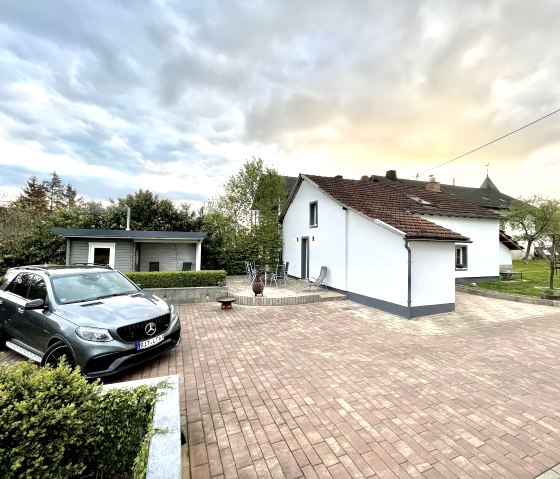 View of the entire residential unit with surroundings