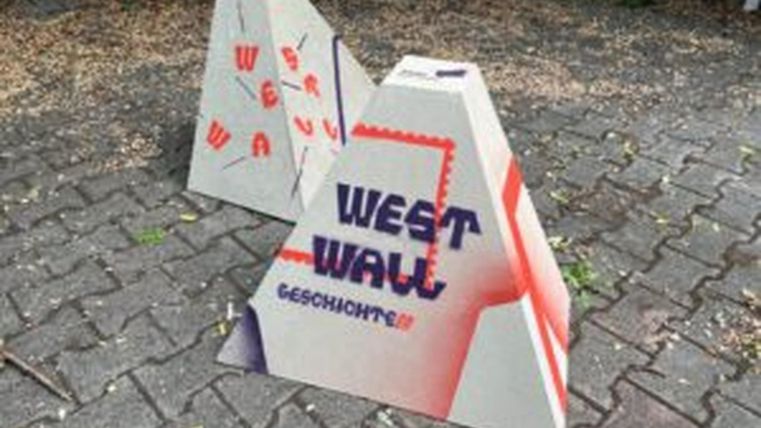 Art installation "Höckerlinie" with colorful designed humps distributed along the streets of Hillesheim.