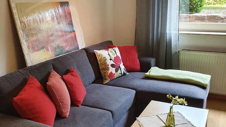 A cozy living room with a gray sofa.