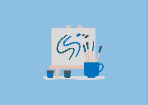 A drawing pad with a blue, curved pattern stands on a stand. Next to it are brushes and paint pots.