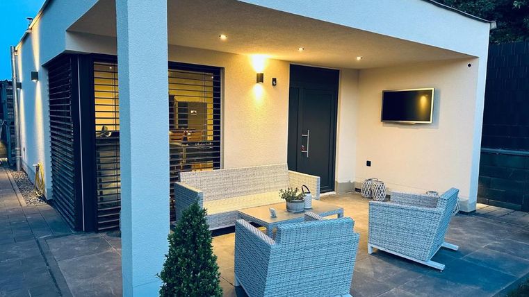 A modern terrace with cozy furniture.