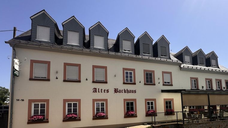 A historic building named "Old Brewery." It has several windows and an inviting atmosphere.