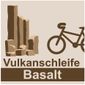 Logo de la boucle volcanique Basalt avec des colonnes de basalte et un vélo.