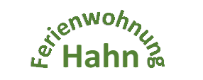 Une écriture stylisée avec le texte "Ferienwohnung Hahn". L'arrière-plan est noir et l'écriture est d'un vert clair.