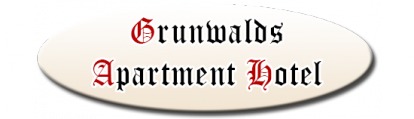 Ein ovales Logo für das "Grunwalds Apartment Hotel". Die Schrift ist in eleganten Farben gestaltet.