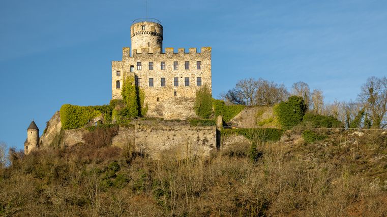 Pyrmont Castle on a hill with a blue sky in the background.
