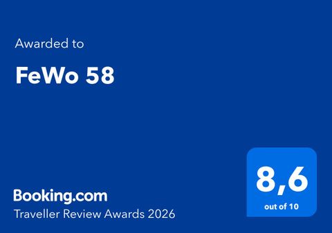 An award plaque from Booking.com. FeWo 58 has received a rating of 8.6 out of 10.