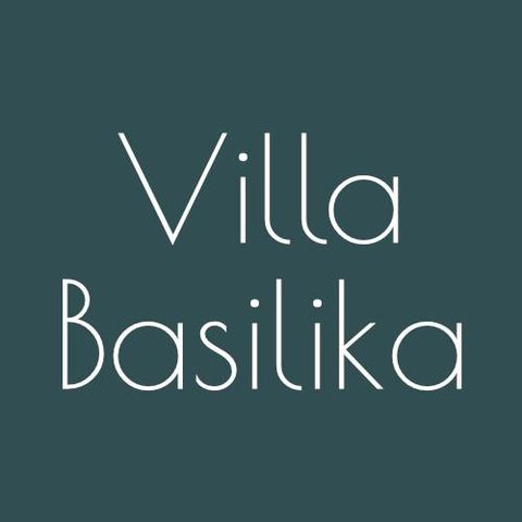 A minimalist logo with the text "Villa Basilika". The font is elegant and modern on a uniform background.