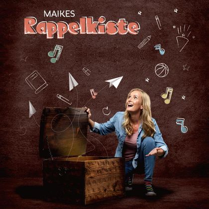 Astonished woman opening a wooden chest