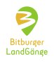 Logo des Bitburger LandGänge avec un symbole vert et jaune qui ressemble à un panneau indicateur et l'inscription 'Bitburger LandGänge' en dessous., © TI Bitburger Land