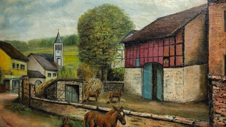 A rural scene featuring an old farmhouse and a horse in the foreground. In the background, a church tower and green trees can be seen.