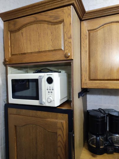 The kitchen is fully equipped except for a dishwasher.