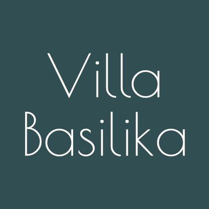 A minimalist logo with the text "Villa Basilika". The font is elegant and modern on a uniform background.