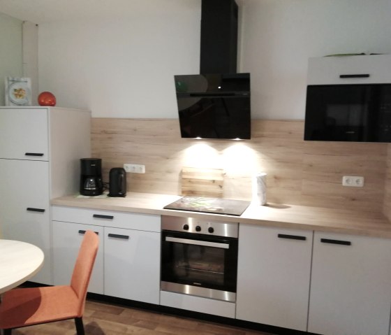 Kitchen:fridge-freezer;Induction;Oven;microwave, © Nordeifel Tourismus GmbH & Ferienwohnung Cocko