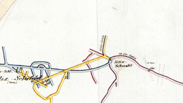 Une vieille carte avec différentes lignes colorées, représentant des routes et des chemins dans une région. Les étiquettes montrent le nom "Fritz-Schubert" et d'autres points de repère.