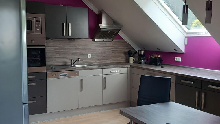 modern and purposefully furnished kitchen with access to west balcony