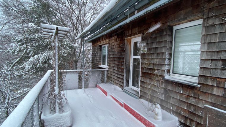 A balcony covered in snow