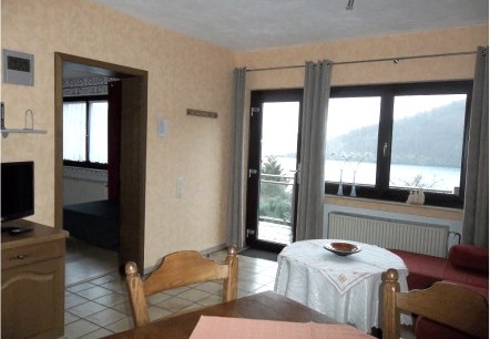 Living/dining room apartment I with view of the Rursee, © Getrud Lauscher
