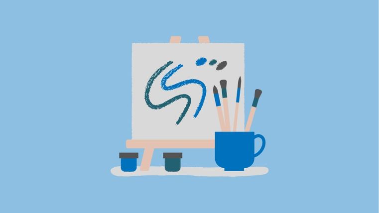 A drawing pad with a blue, curved pattern stands on a stand. Next to it are brushes and paint pots.