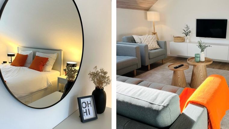 Une chambre élégante avec un grand miroir et un lit confortable. Dans le salon, il y a des meubles modernes et des éléments décoratifs.