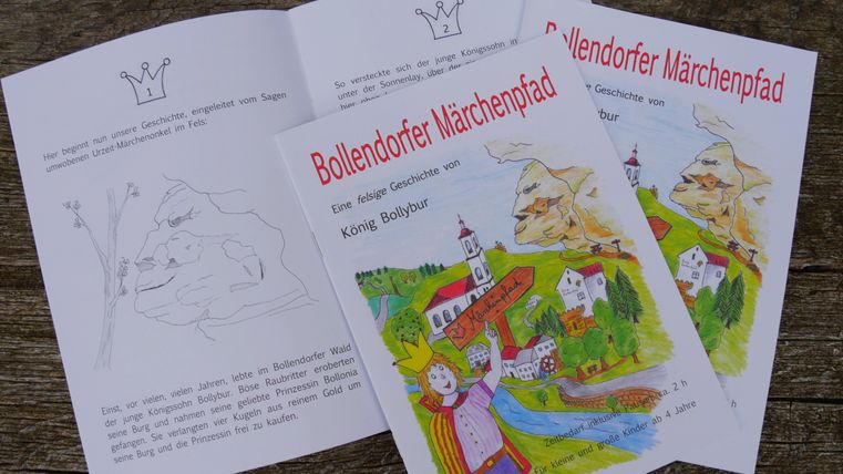 Malbuchseiten des Bollendorfer Märchenpfads mit Zeichnungen und Text.